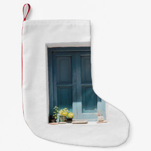BLUE WOODEN DOOR ON WHITE CONCRETE WALL SMALL CHRISTMAS STOCKING