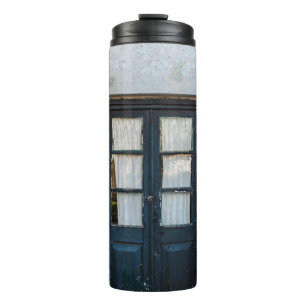 BLUE WOODEN DOOR PANEL IN WHITE BUILDING THERMAL TUMBLER