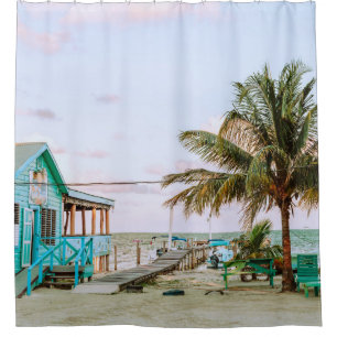 BLUE WOODEN HOUSE NEAR BODY OF WATER