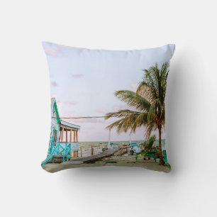 BLUE WOODEN HOUSE NEAR BODY OF WATER THROW PILLOW