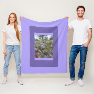 Bluebells on a rocky hillside fleece blanket