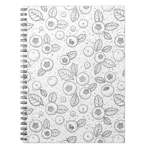 Blueberries on black and white notebook