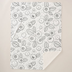 Blueberries on black and white sherpa blanket