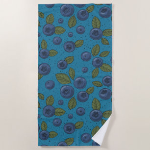 Blueberries on blue beach towel