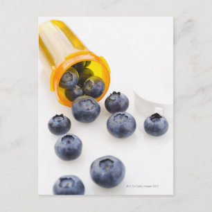 Blueberries spilling from prescription bottle postcard