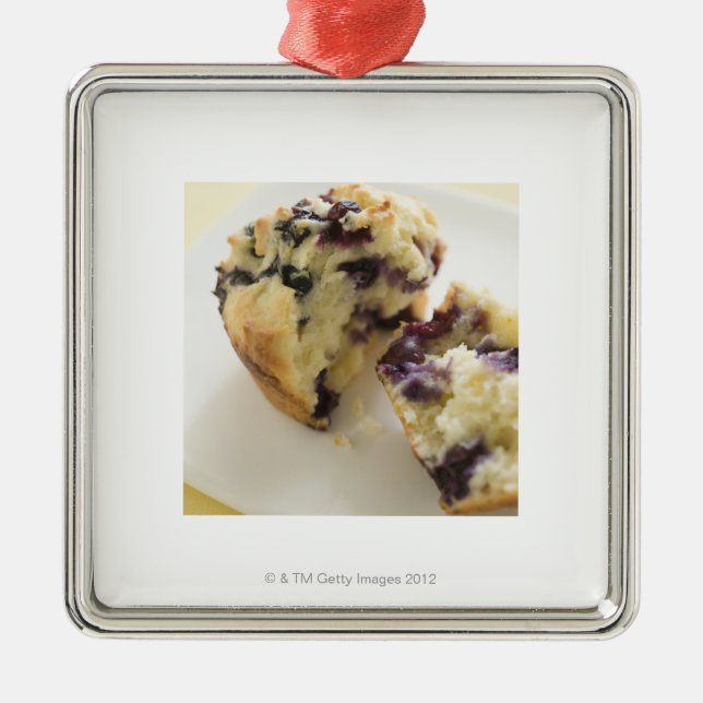 Blueberry muffin split open on a white plate metal ornament (Front)