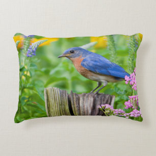 Bluebird male on fence post in flower garden accent pillow