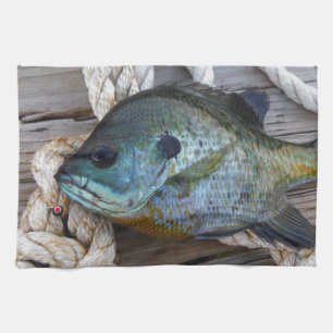 Bluegill fish on dock and rope kitchen towel