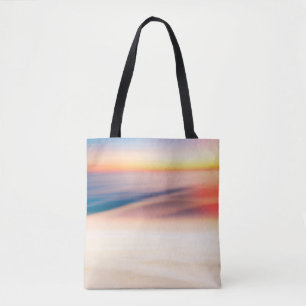 Blur tropical sunset beach with bokeh sun light wa tote bag