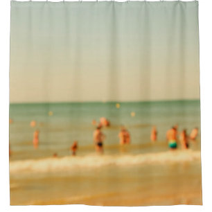 Blurred beach photo with bokeh. People relaxing on