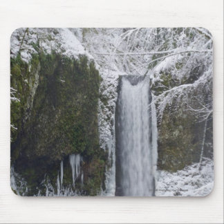 Blurry Waterfall Surrounded by a Snowy Forest Mouse Pad