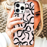 Blush And Black Bow Monogram iPhone 16 Pro Max Case<br><div class="desc">Dress up your phone in style with this chic and trendy blush pink and black phone case! Featuring a playful pattern of hand-drawn bows and personalized with your monogram, this case is the perfect blend of fashion and function. Made from durable materials to protect your phone from everyday bumps and...</div>