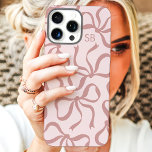 Blush Pink Bow Monogram iPhone 16 Pro Max Case<br><div class="desc">Dress up your phone in style with this chic and trendy blush pink phone case! Featuring a playful pattern of hand-drawn bows and personalized with your monogram, this case is the perfect blend of fashion and function. Made from durable materials to protect your phone from everyday bumps and scratches. A...</div>