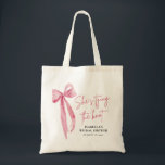 Blush Pink Bow She's Tying the Knot Bridal Shower  Tote Bag<br><div class="desc">The "Blush Pink Bow: She's Tying the Knot" Bridal Shower Tote Bag is a stylish and practical accessory for the bride-to-be and her bridal party. With its elegant blush pink bow design, this tote bag adds a touch of sophistication to any bridal shower celebration. Spacious enough to hold essentials like...</div>