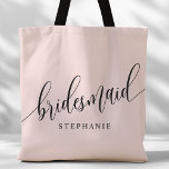 Blush Pink Bridesmaid Modern Script Tote Bag<br><div class="desc">Show your appreciation to your bridal party with this stylish blush pink bridesmaid tote bag. Featuring modern script and customizable with your bridesmaid's name, this tote bag is both practical and elegant. The soft colour and chic design make it perfect for carrying wedding day essentials or everyday items. This personalized...</div>