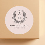 Blush Pink Crest Modern Monogram Wedding  Classic Round Sticker<br><div class="desc">Add a soft, elegant touch to your wedding with the Blush Pink Crest Modern Monogram Wedding Classic Round Sticker. Featuring a gentle blush pink background, a delicate crest design, and a personalized monogram, this sticker is perfect for enhancing your wedding invitations, favours, or decor. Its romantic and modern style makes...</div>