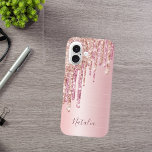 Blush pink rose gold metallic name monogram script iPhone 16 case<br><div class="desc">An elegant,  girly and glam phone case. Faux rose gold and pink glitter drip,  paint drip.  Chic blush pink faux metallic looking background. Personalize and add your name,  written with a modern hand lettered style script. Dark rose gold colored letters.</div>