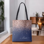 Blush Pink Rose Gold Navy Blue Glitter Monogram Tote Bag<br><div class="desc">Navy Blue,  Pink Rose Gold and Blush Pink Faux Sparkle and Glitter Elegant Monogram Book Bag. This Book Bag can be customized to include your initial and first name and given as a gift for Christmas,  Sweet 16 Birthday,  Bridal Shower or a Wedding.</div>