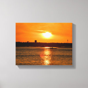 Boat cruising on the river sunset canvas print