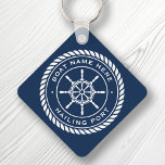 Boat name and hailing port nautical ship's wheel keychain<br><div class="desc">Keychain featuring a white,  elegant ship's wheel and rope emblem with custom boat name and hailing port (or other custom text) on a dark blue background.</div>