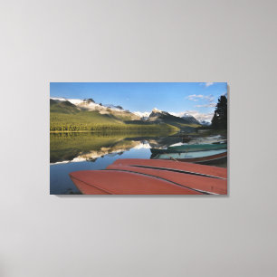 Boats parked on the lakeshore of Maligne Lake, Canvas Print