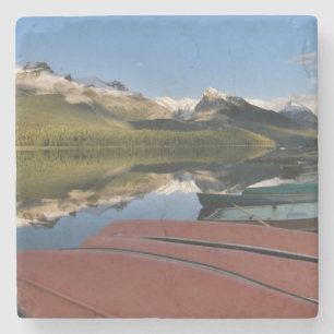 Boats parked on the lakeshore of Maligne Lake, Stone Coaster
