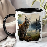 Bobcat in Forest Clearing  Mug<br><div class="desc">Start your day with the Bobcat in Forest Clearing Mug. This unique mug features a striking image of a bobcat standing alert in a forest clearing, surrounded by lush greenery and tall trees. Customized with your name, this mug adds a personal touch to your morning routine. Perfect for enjoying coffee,...</div>