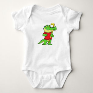 Body Crocodile au hockey sur gazon avec bâton de hockey
