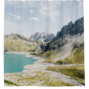 BODY OF WATER SURROUNDED BY MOUNTAINS