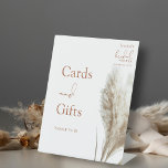Boho Pampas Grass Bridal Shower Cards and Gifts Pedestal Sign<br><div class="desc">Boho Pampas Grass Bridal Shower Cards and Gifts Pedestal Sign. Guide your guests with style using this Boho Pampas Grass Bridal Shower Cards and Gifts Pedestal Sign, set against a clean white backdrop. Perfect for your bohemian-themed celebration, this sign features a soft and neutral earthy colour tone that stands out...</div>
