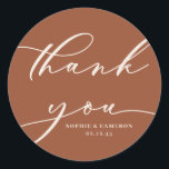 Boho Terracotta Calligraphy Wedding Thank You Classic Round Sticker<br><div class="desc">Send thanks with this customizable script thank you stickers. It features modern calligraphy and classic typography with a terracotta background. Personalize this script thank you sticker by adding your own details. This terracotta thank you card will be perfect for wedding favours and as an envelope seal.</div>