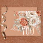 Boho Terracotta Peach & Cream Floral Wedding Thank You Card<br><div class="desc">Set the tone for your special day with our enchanting boho rustic wedding thank you card. Featuring a soft terracotta rust background, this design is adorned with a stunning spray of watercolor flowers and dried grasses. Delicate hues of peach blush, cream, and light sage green foliage, intertwined with light beige...</div>