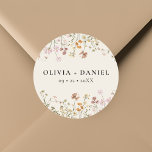 Boho Wildflower Beige Garden Wedding Classic Round Sticker<br><div class="desc">Add a charming touch to your wedding stationery or favours with our Boho Wildflower Beige Garden Wedding Classic Round Sticker. Featuring delicate wildflower illustrations on a soft beige background, this versatile sticker is perfect for sealing envelopes, adorning favour bags, or adding a personal touch to decor. Its elegant design complements...</div>