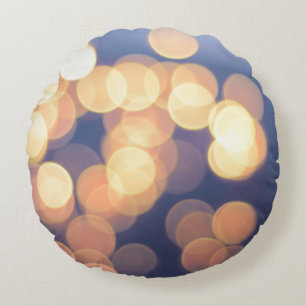 Bokeh photography of lights round pillow