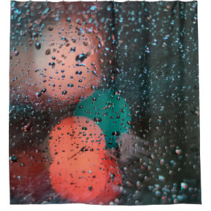 Bokeh photography of water droplets on clear glass