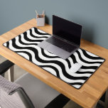 Bold Black and White Wavy Abstract Desk Mat<br><div class="desc">A striking visual effect is created by a seamless pattern of wavy black lines on a white background</div>