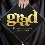 Bold gold typography on black simple modern graduation cap topper<br><div class="desc">Your favourite grad will stand out and make a statement when they wear this graduation cap topper! Let them celebrate their milestone with this stunning, simple, modern, custom graduation keepsake. Bold, graphic, faux gold foil typography overlays a black background. Personalize with your grad’s name and class year. Matching announcements, address...</div>