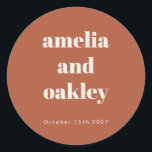 Bold Minimalist Boho Rust Retro Custom Wedding Classic Round Sticker<br><div class="desc">Add a personal touch to your wedding favours or stationery with these customizable terracotta stickers. Featuring your names and wedding date in a minimalist design, these stickers are perfect for sealing envelopes, decorating gift bags, or personalizing party favours. The warm rust tone and clean typography make them an elegant addition...</div>