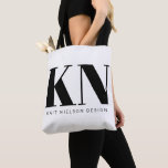 Bold Modern Monogram Name Custom Black White Tote Bag<br><div class="desc">This chic and stylish tote bag is designed with bold, customizable initials and a name or business name in a minimalist black and white style, perfect for personal or professional branding. The spacious bag makes it ideal for carrying everything from books to groceries, showcasing your unique brand or initials wherever...</div>