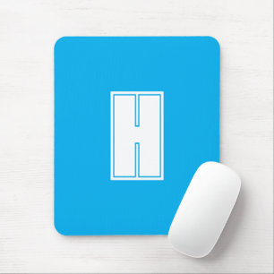 Bold white initial bright blue mouse pad