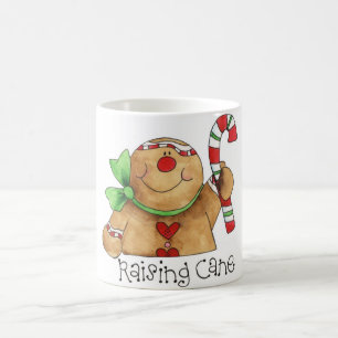 Bonhomme en pain d'épice soulevant la tasse de