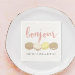 Bonjour French Macarons Bridal Shower Napkin<br><div class="desc">Bonjour! Add a touch of Parisian style to your bridal shower with these pretty cocktail napkins. Design features four delicious French macaron illustrations in pastel pink, ivory, tan and pale yellow, with "Bonjour" in peachy pink handwritten style script lettering. Customize with the guest of honour's name for a personalized touch....</div>