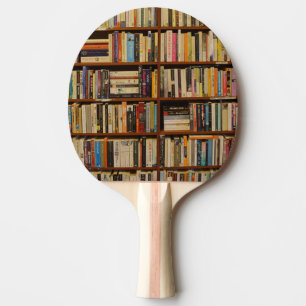 Books in the library  ping pong paddle