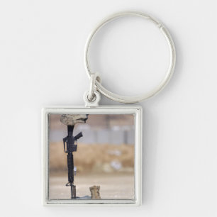 Boots, rifle, dog tags, and protective helmet keychain