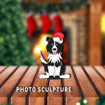 Border Collie Christmas Pet Ornament Photo Sculpture Ornament<br><div class="desc">Adorable,  black/white Border Collie cartoon graphic wearing a red/white Santa Claus hat,  and has pink tongue out.



Graphic by:  Lori@SaltTownStudio</div>