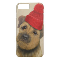 Border Terrier with Red Bobble Hat