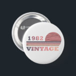 born in 1982 vintage birthday gift 2 inch round button<br><div class="desc">You can add some originality to your wardrobe with this modern and elegant purple and pink colour sunset vintage retro-looking birthday design with awesome typography font lettering, it is a great gift idea for women, wives, and girlfriends who will love this one-of-a-kind artwork. The best and most fun holiday present...</div>