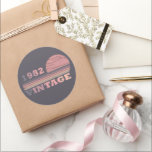 born in 1982 vintage birthday gift classic round sticker<br><div class="desc">You can add some originality to your wardrobe with this modern and elegant purple and pink colour sunset vintage retro-looking birthday design with awesome typography font lettering, it is a great gift idea for women, wives, and girlfriends who will love this one-of-a-kind artwork. The best and most fun holiday present...</div>