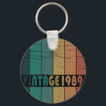 Born in 1989 vintage birthday gift keychain<br><div class="desc">You can add some originality to your wardrobe with this original 1989 vintage sunset retro-looking birthday design with awesome colours and typography font lettering, is a great gift idea for men, women, husband, wife girlfriend, and a boyfriend who will love this one-of-a-kind artwork. The best and most fun holiday present...</div>