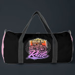 Born To Ride Motorcycle  Duffle Bag<br><div class="desc">This vibrant black duffle bag features a retro-style motorcycle graphic within a shield, boldly stating "BORN TO RIDE". The colourful, distressed text and circular pattern add to its classic appeal. Perfect for motorcycle enthusiasts, this bag expresses a deep passion for riding and the open road. Edit colour of the bag...</div>